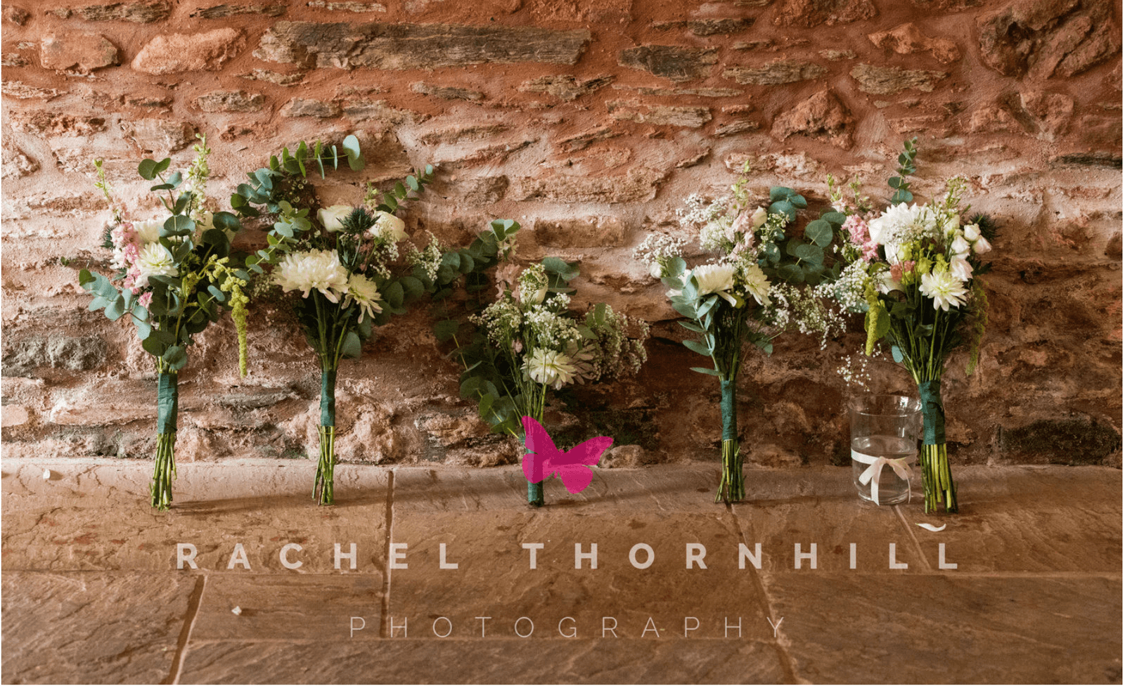 Bouquets against stone wall